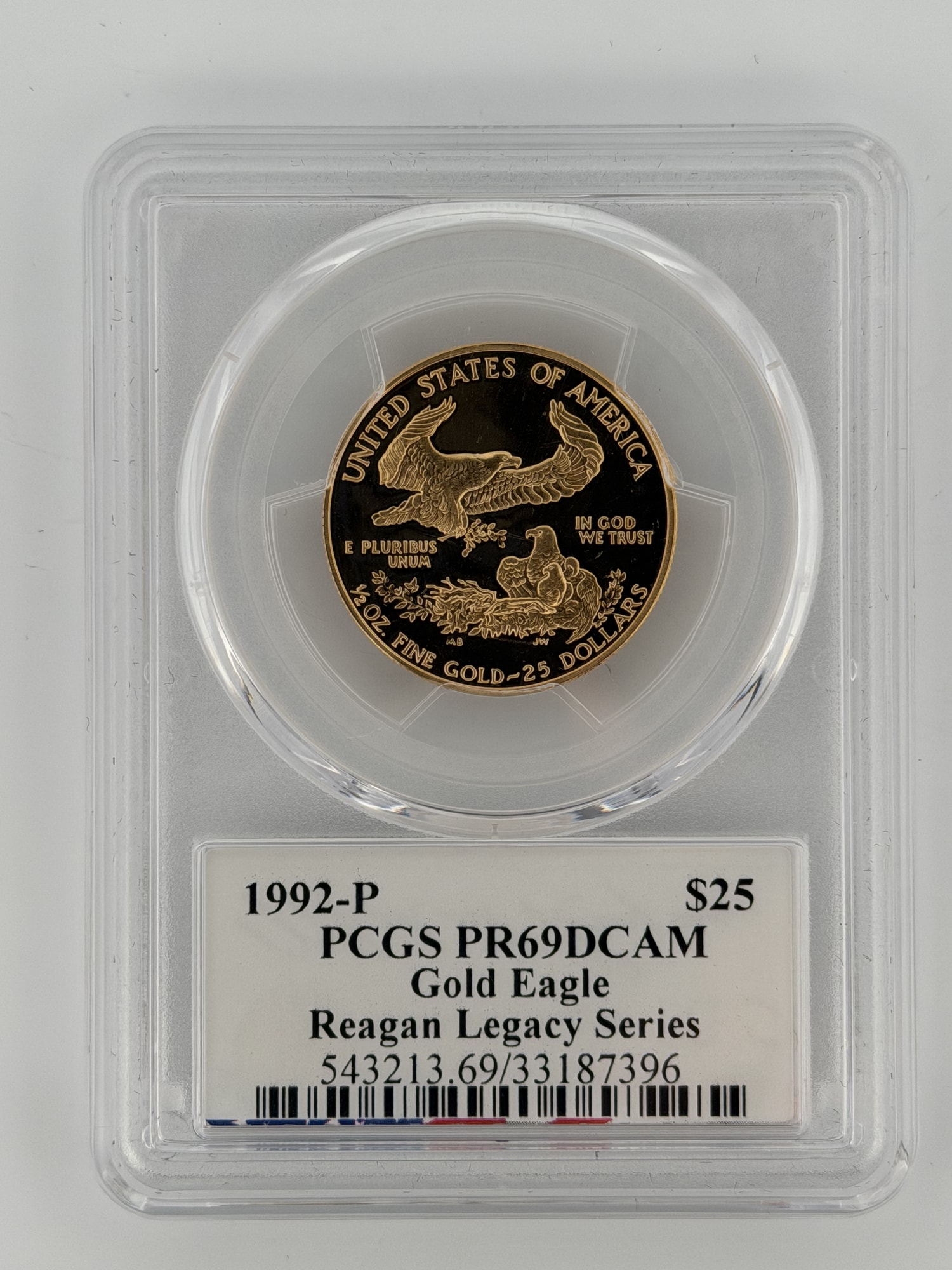 1992-P $25 American Gold Eagle Proof PCGS PR69DCAM reverse showing family of bald eagles in tamper-evident slab with Reagan Legacy Series la