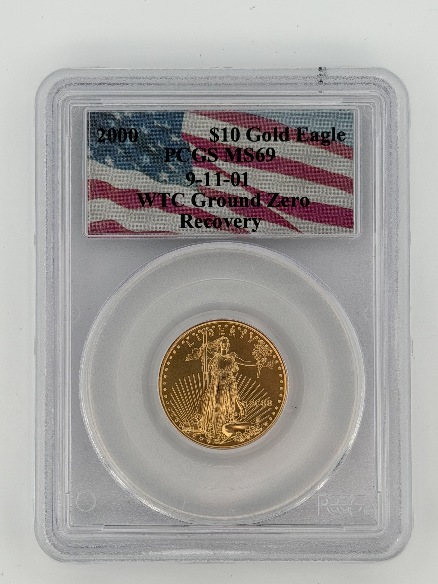 2000 $10 American Gold Eagle PCGS MS69 WTC Ground Zero Recovery slab obverse with American flag label and Lady Liberty design