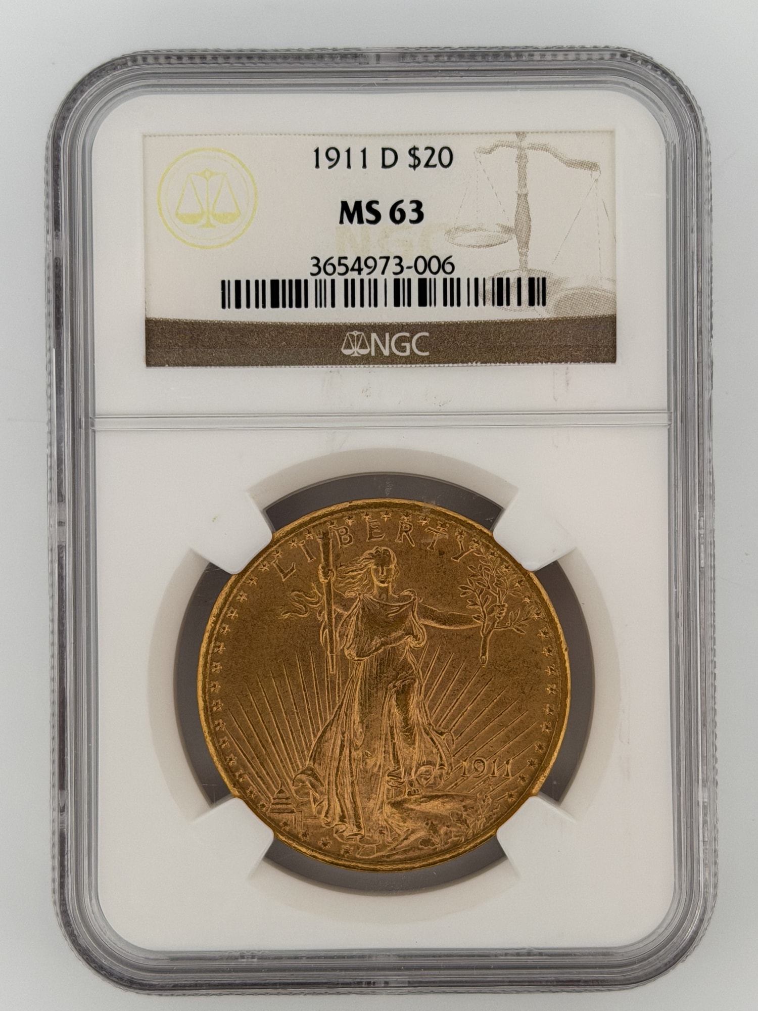 1911-D Saint-Gaudens Double Eagle $20 gold coin obverse in NGC MS63 slab showing striding Liberty design