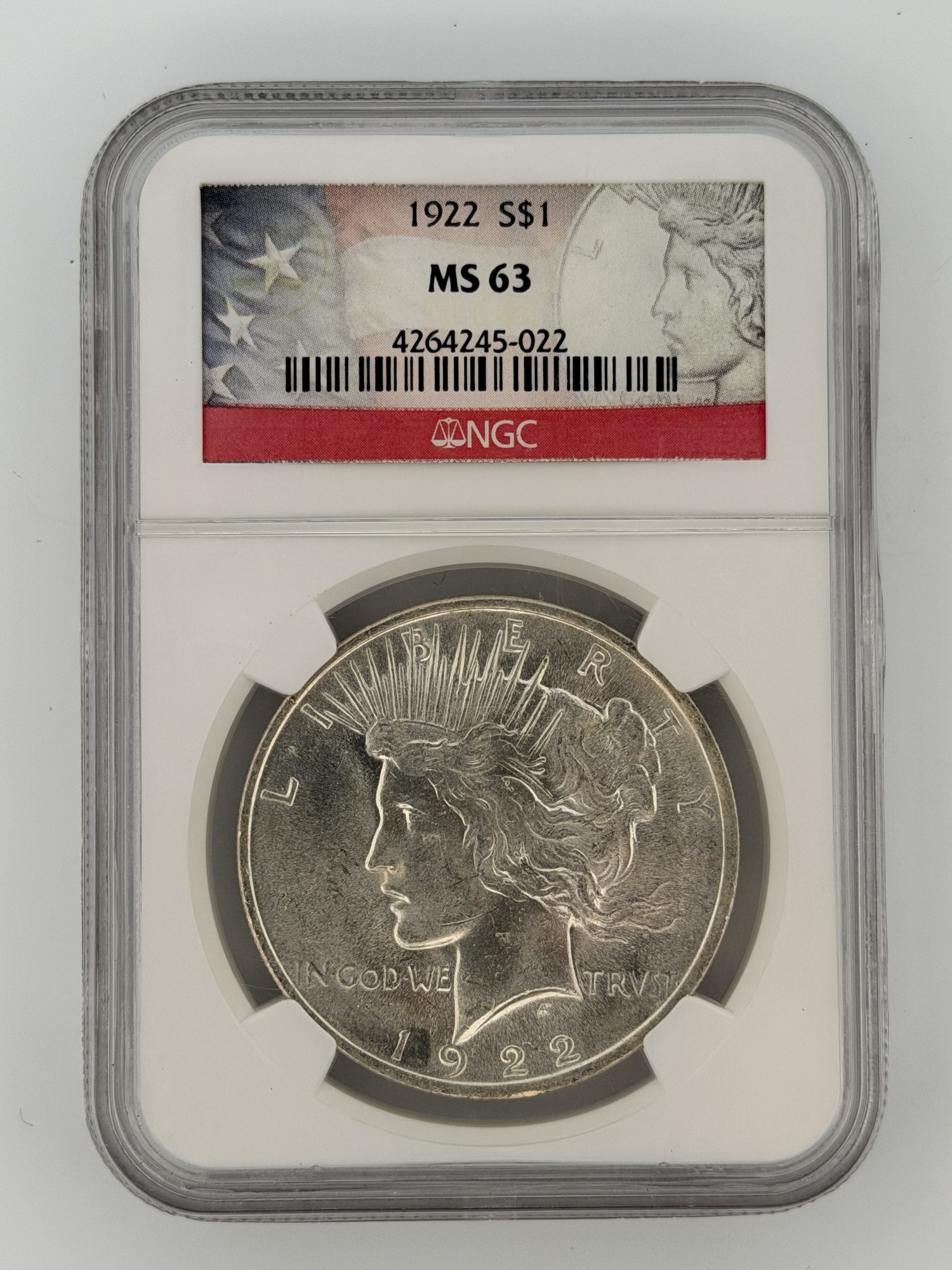 1922 Peace Silver Dollar NGC MS-63 obverse in slab showing Liberty portrait and radiate crown, certification label visible